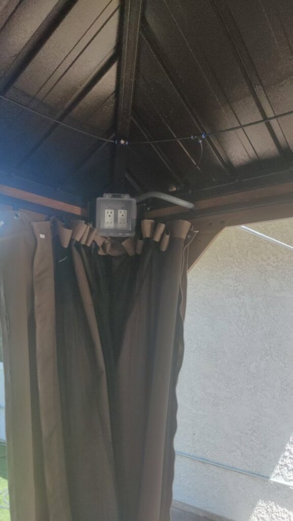An outdoor electrical outlet box installed under a gazebo roof by Canyon Electric Company, Inc. in North Las Vegas, NV