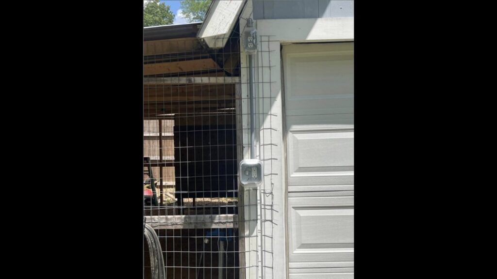 Outdoor electrical conduit and outlet installation on a building by Spencer Electric in Hopkins, MN.