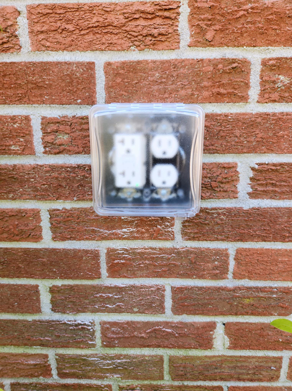 A newly installed outdoor electrical outlet with a weather-resistant cover by Wire Nutz LLC in Vancouver, WA