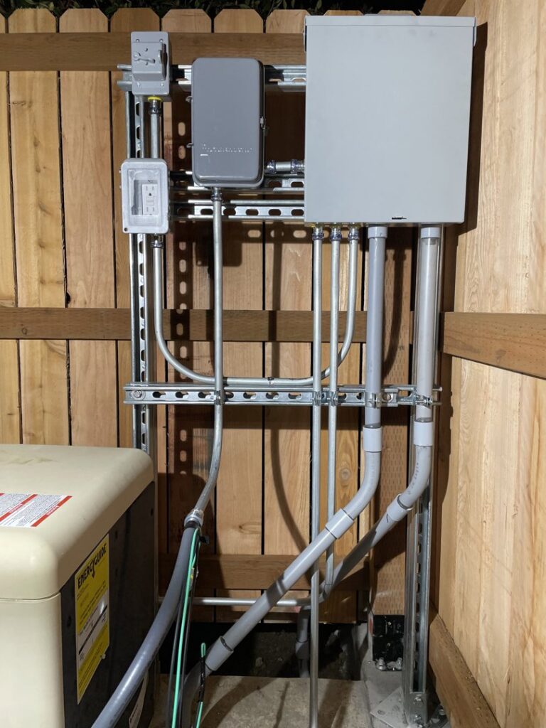 An outdoor electrical panel and conduit system professionally installed by Delatour Electric in Portland, OR.