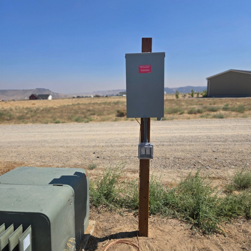 A newly installed outdoor electrical panel and outlet by Balanced Electric LLC in Caldwell, ID.