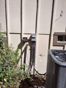 An outdoor electrical panel and conduit professionally installed by Black Bear Electric in Aurora, CO.