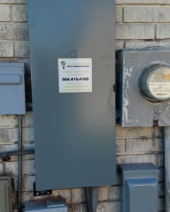 An outdoor electrical panel and meter installed by Joule Electrical A/C & Heating Services in New Orleans, LA.