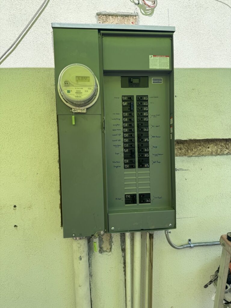 An outdoor electrical panel and meter box installed on a building by MCM Electrical Services LLC in Phoenix, AZ