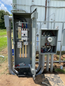 An outdoor electrical panel and meter base installation by Savoski's Electrical & AC, LLC in Sunset, LA