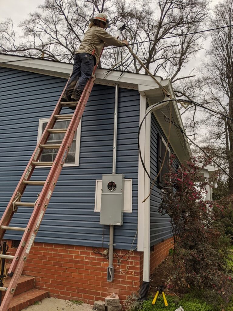 Outdoor electrical panel and wiring installation on a house by Starnes Electric LLC in Rock Hill, SC.