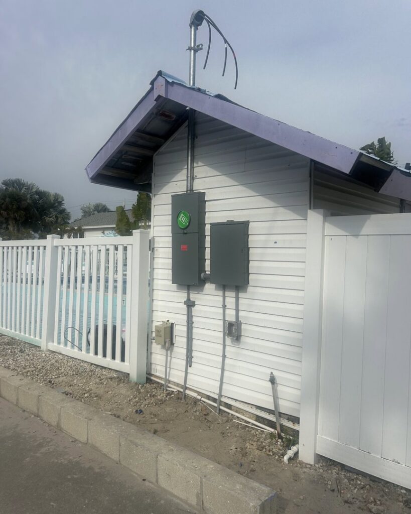 Outdoor electrical panels and conduit for pool equipment installed by Sound Electric LLC in Saint James City, FL.