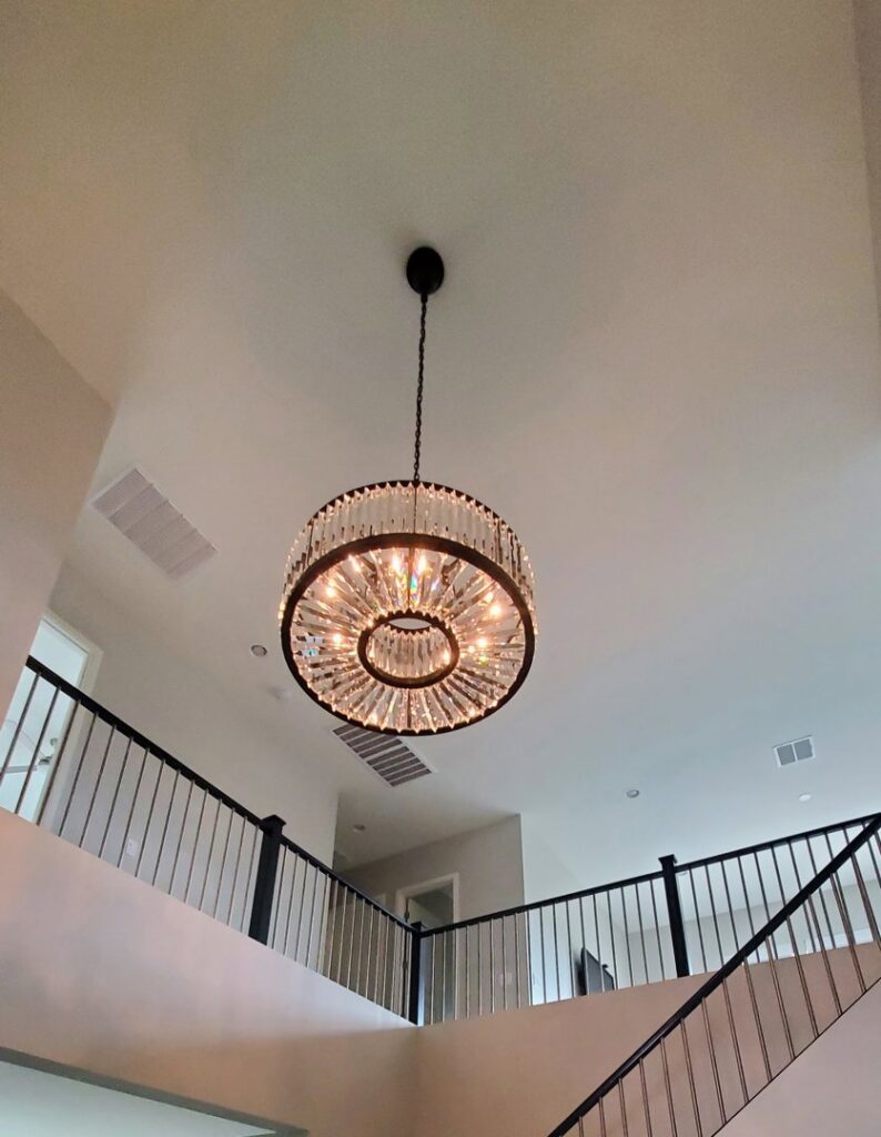 Outdoor electrical meter and service boxes installed on a white brick wall by Star Light Electric LLC in Phoenix, AZ