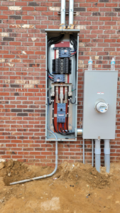 Outdoor electrical service panel and meter base installation by A.C. Electrical in Sumter, SC.