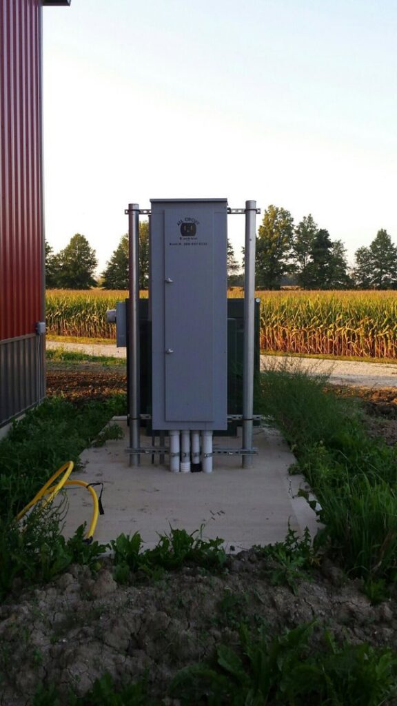 An outdoor electrical service panel and transformer installed by All Circuit Electrical LLC for a building in Bryant, IN.