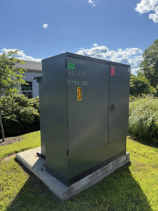 A large outdoor electrical transformer box, indicating commercial electrical work by Goodless Electric in West Springfield, MA.