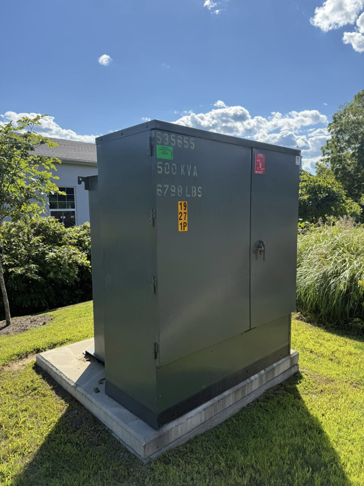 A large outdoor electrical transformer box, indicating commercial electrical work by Goodless Electric in West Springfield, MA.
