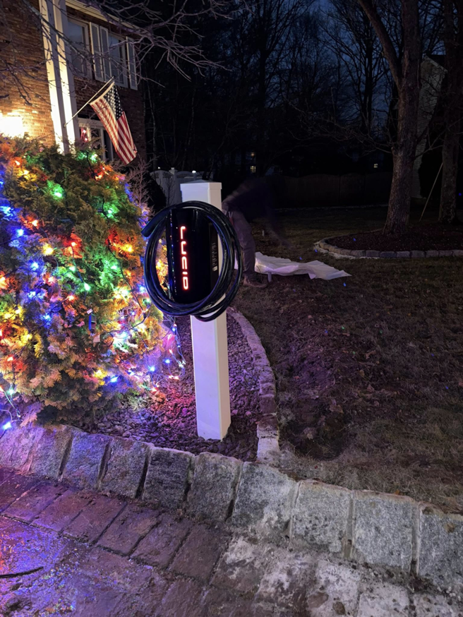 An outdoor EV charging station installed on a pedestal by J Pownall Electric LLC in Hamilton, NJ.
