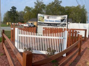 An outdoor fence display area showcasing various fence types available from Sunrise Fences in Goose Creek, SC.