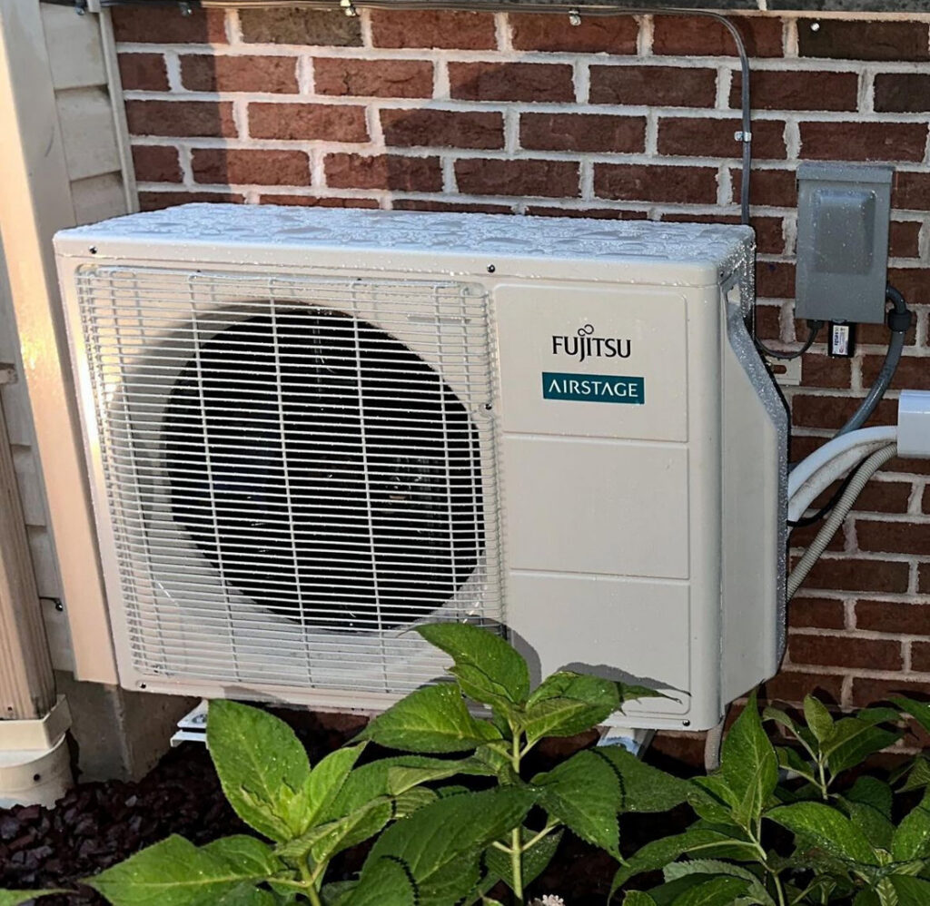 An outdoor Fujitsu Airstage mini-split condenser unit professionally installed by Alpine Pro Solutions in Allentown, PA.