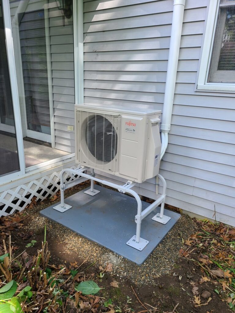 An outdoor Fujitsu mini-split condenser unit installed by Hampden County HVAC Inc. in Indian Orchard, MA