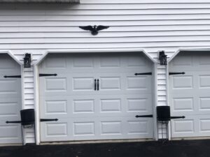 Outdoor light fixtures installed above garage doors by The Dorky Electrician, LLC in Coplay, PA