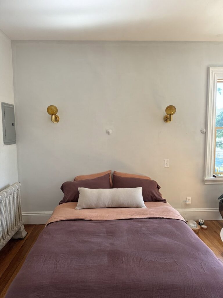 Exterior view of a garage with new outdoor lighting fixtures installed by Border Electrical Contractor LLC in Nashua, NH.