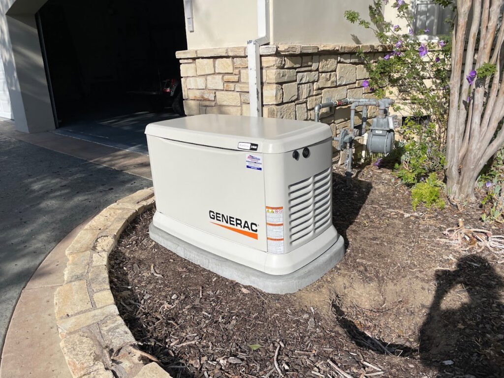 An outdoor Generac standby generator installation in a landscaped area by Gen Central Power Systems in Houston, TX