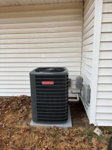An outdoor Goodman AC unit newly installed next to a house by Stanton Home Comfort in Fordland, MO.