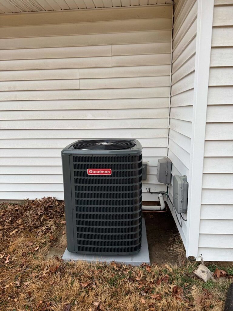 An outdoor Goodman AC unit newly installed next to a house by Stanton Home Comfort in Fordland, MO.