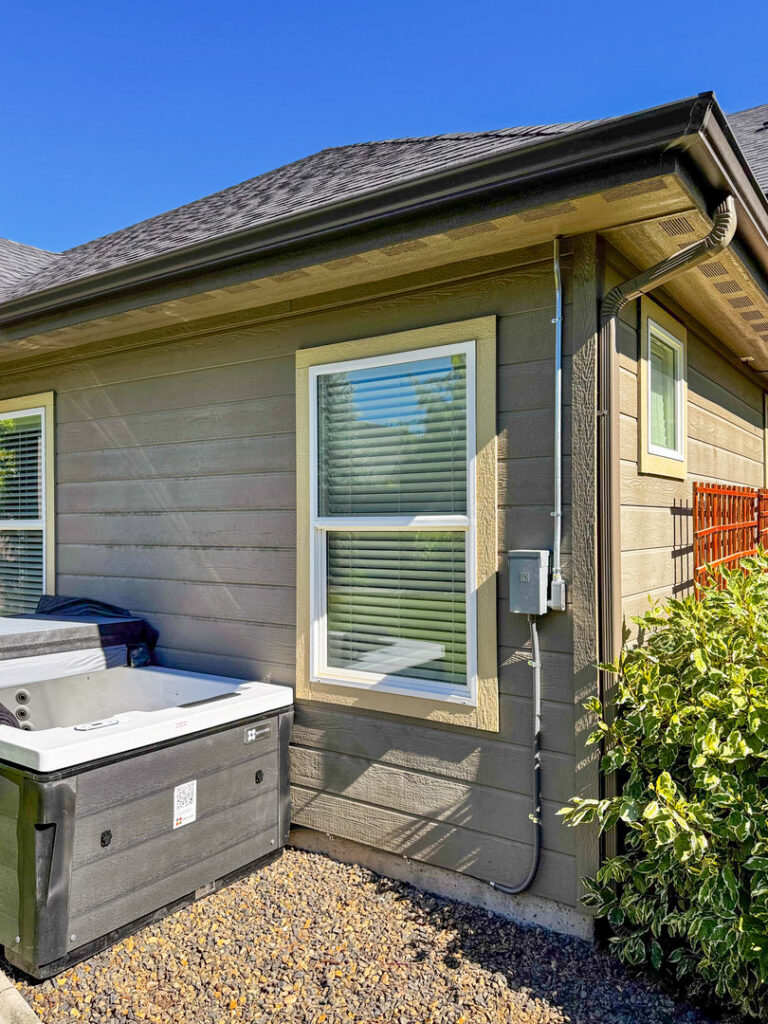 Outdoor electrical conduit and box for a hot tub hookup installed by Tier 1 Electric in Boise, ID.