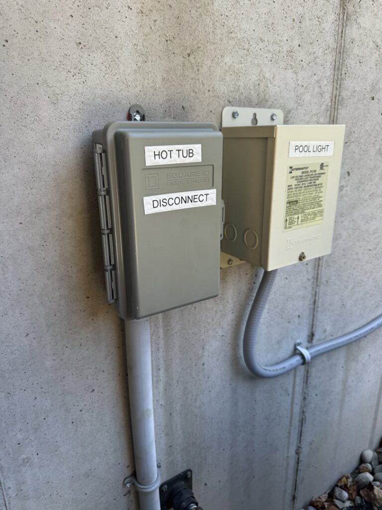 Outdoor electrical disconnect for a hot tub and pool light transformer installed by Rudis Electrical LLC in Scranton, PA.