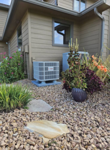 An outdoor HVAC air conditioner unit installed by Reliance Heating & Cooling in Yankton, SD.