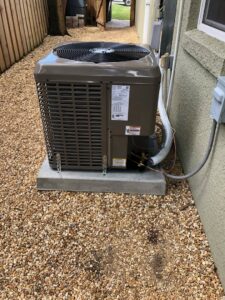 An outdoor HVAC condenser unit installed or serviced by Associated Piping Services in Orlando, FL.