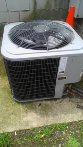 An outdoor HVAC condenser unit, representing services offered by Bart Fey HVAC and Plumbing LLC in West Jefferson, OH.