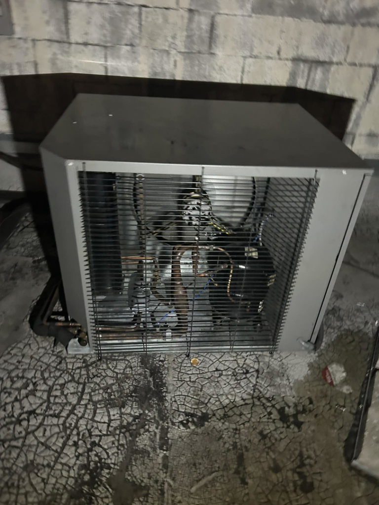 An outdoor HVAC condenser unit showing internal components, serviced by 511Comfort, LLC in Nashville, TN.
