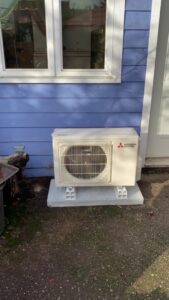 An outdoor HVAC condenser unit installed by Energy Technologies in Seattle, WA.