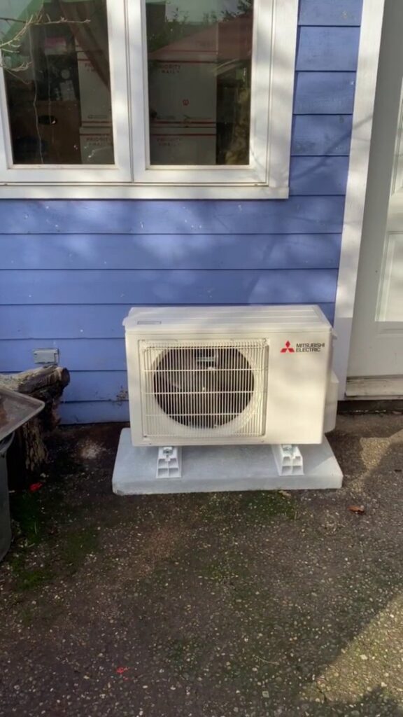 An outdoor HVAC condenser unit installed by Energy Technologies in Seattle, WA.