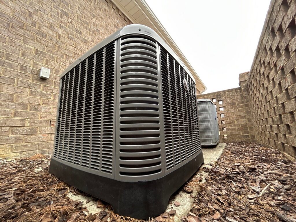 An outdoor HVAC condenser unit installed by Integrity Services Heating and Cooling in Madison, AL.