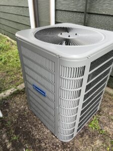 An outdoor HVAC condenser unit installation by The Montz Company in Kentwood, LA