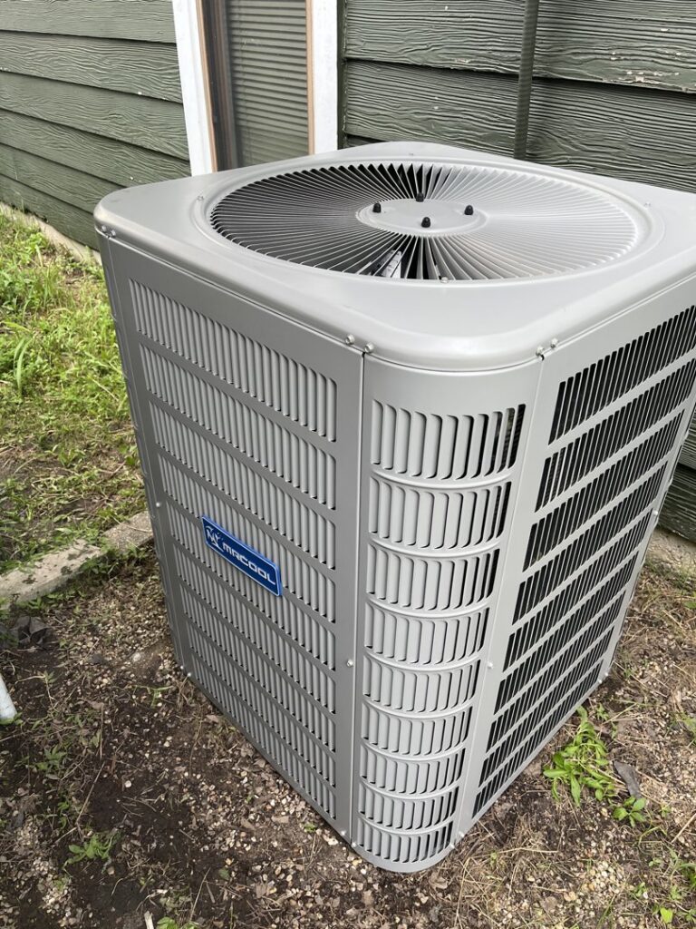 An outdoor HVAC condenser unit installation by The Montz Company in Kentwood, LA
