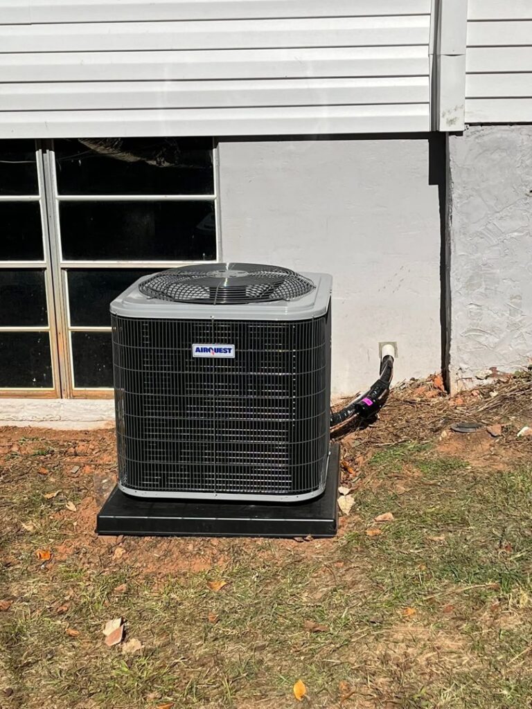 An outdoor HVAC condenser unit installed next to a house foundation by On-Target Heating & Air LLC in Rock Hill, SC.