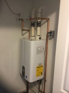 An outdoor HVAC condenser unit at a residential property, serviced by M&M Heating and Cooling in Toledo, OH.