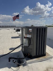 An outdoor HVAC condenser unit installed on a rooftop, ready for service by Blue Collar Mechanical LLC in Indianapolis, IN.
