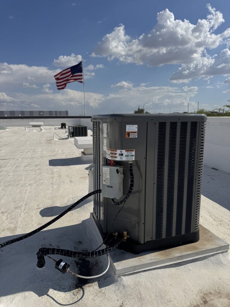 An outdoor HVAC condenser unit installed on a rooftop, ready for service by Blue Collar Mechanical LLC in Indianapolis, IN.