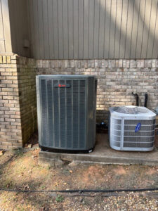 Two outdoor HVAC condenser units installed by Rivertech Heating & Air Conditioning for a home in Chattanooga, TN.