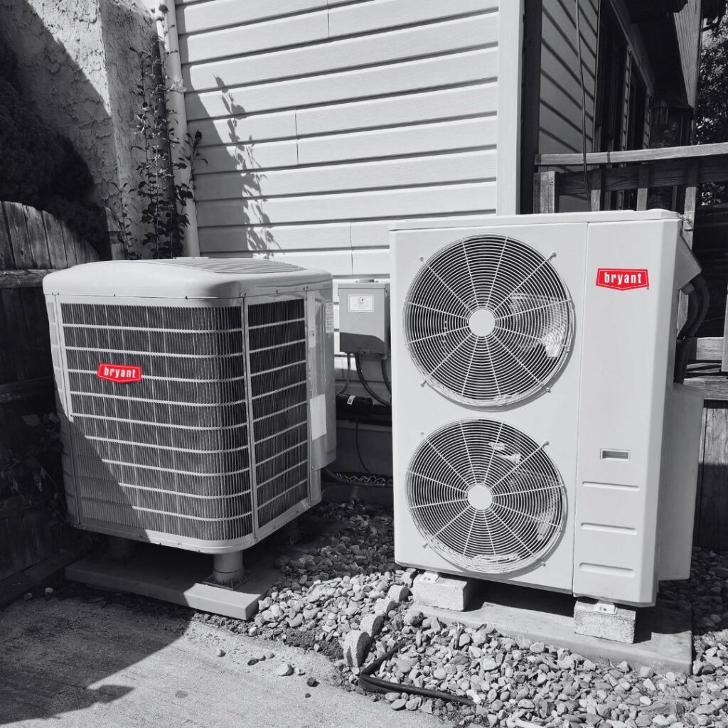 Two outdoor HVAC condenser units installed by Synergy3, an HVAC contractor in Philadelphia, PA.