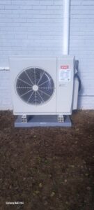 An outdoor HVAC heat pump unit installed by Synergy3, an HVAC contractor in Philadelphia, PA.