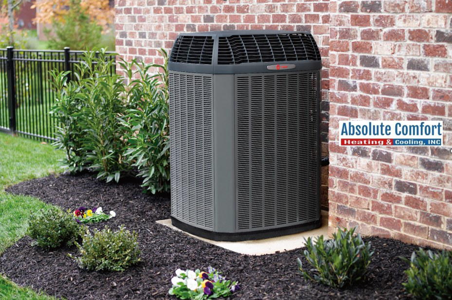 An outdoor HVAC unit installed next to a brick home by Absolute Comfort Heating & Cooling, Inc. in Virginia Beach, VA.