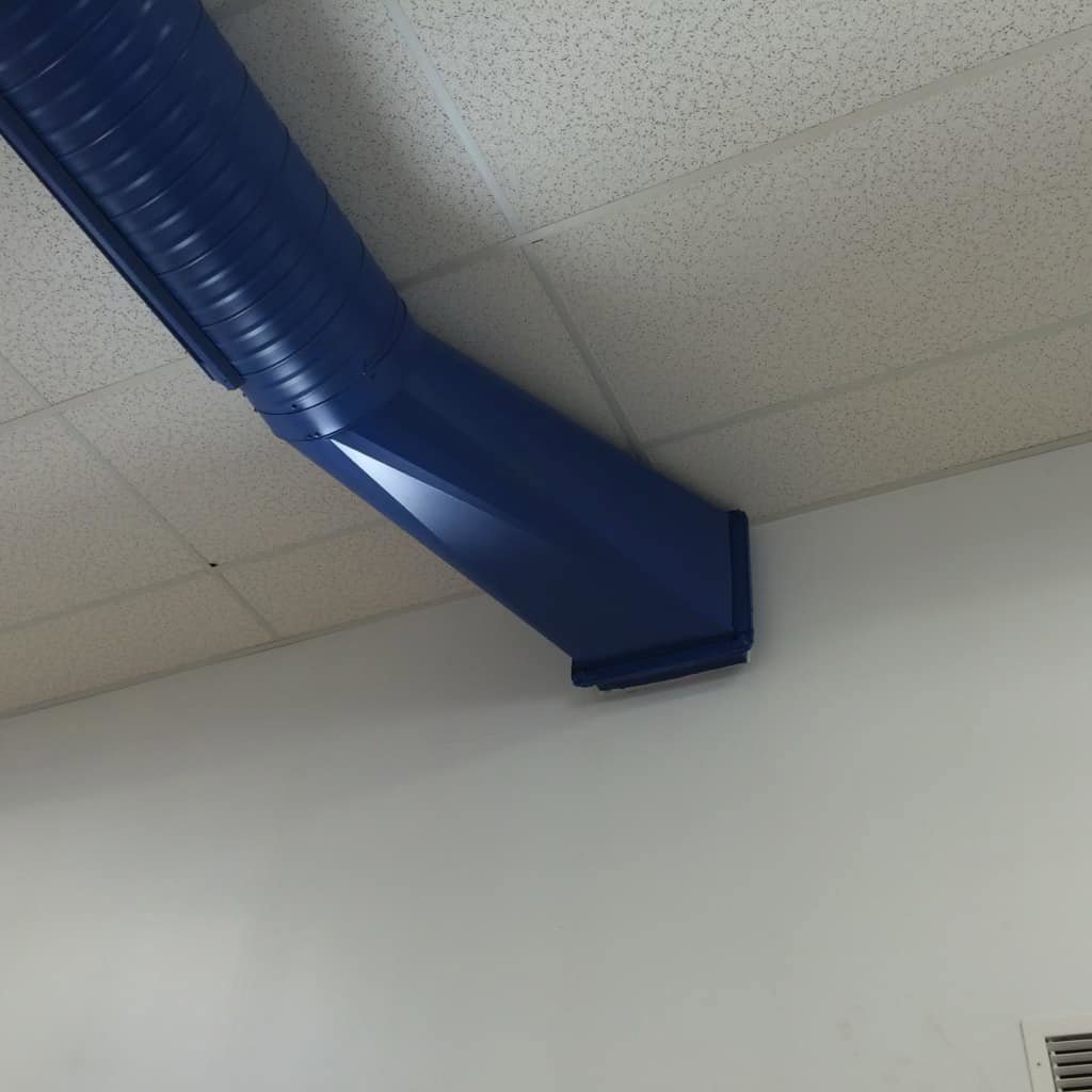 An outdoor HVAC unit being cleaned and serviced by Foremost Mechanical Services in Hartford, CT.