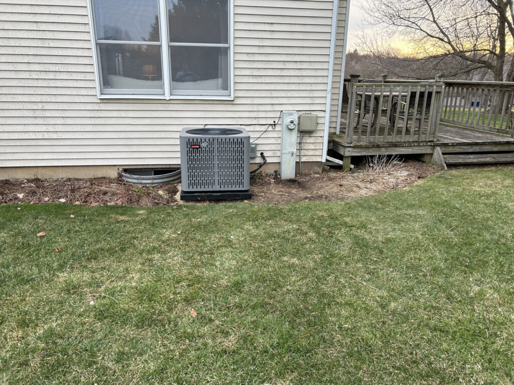 An outdoor HVAC unit, likely an air conditioner condenser, installed or serviced by Fire & Ice Mechanical in South Elgin, IL