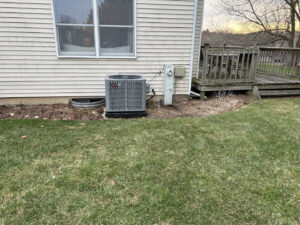 An outdoor HVAC unit, likely an air conditioner condenser, installed or serviced by Fire & Ice Mechanical in South Elgin, IL