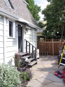 An outdoor HVAC unit installed next to a residential home by Progressive Comfort Solutions in Seattle, WA.