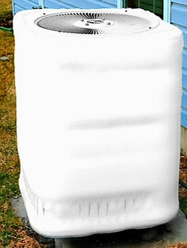An outdoor HVAC unit covered with a white protective cover for winterization by Madison HVAC/R, Inc in Richmond, KY.