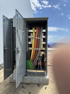 Outdoor industrial electrical cabinet with heavy-gauge colored wiring, installed by TF Electrical Solutions in Omaha, NE.